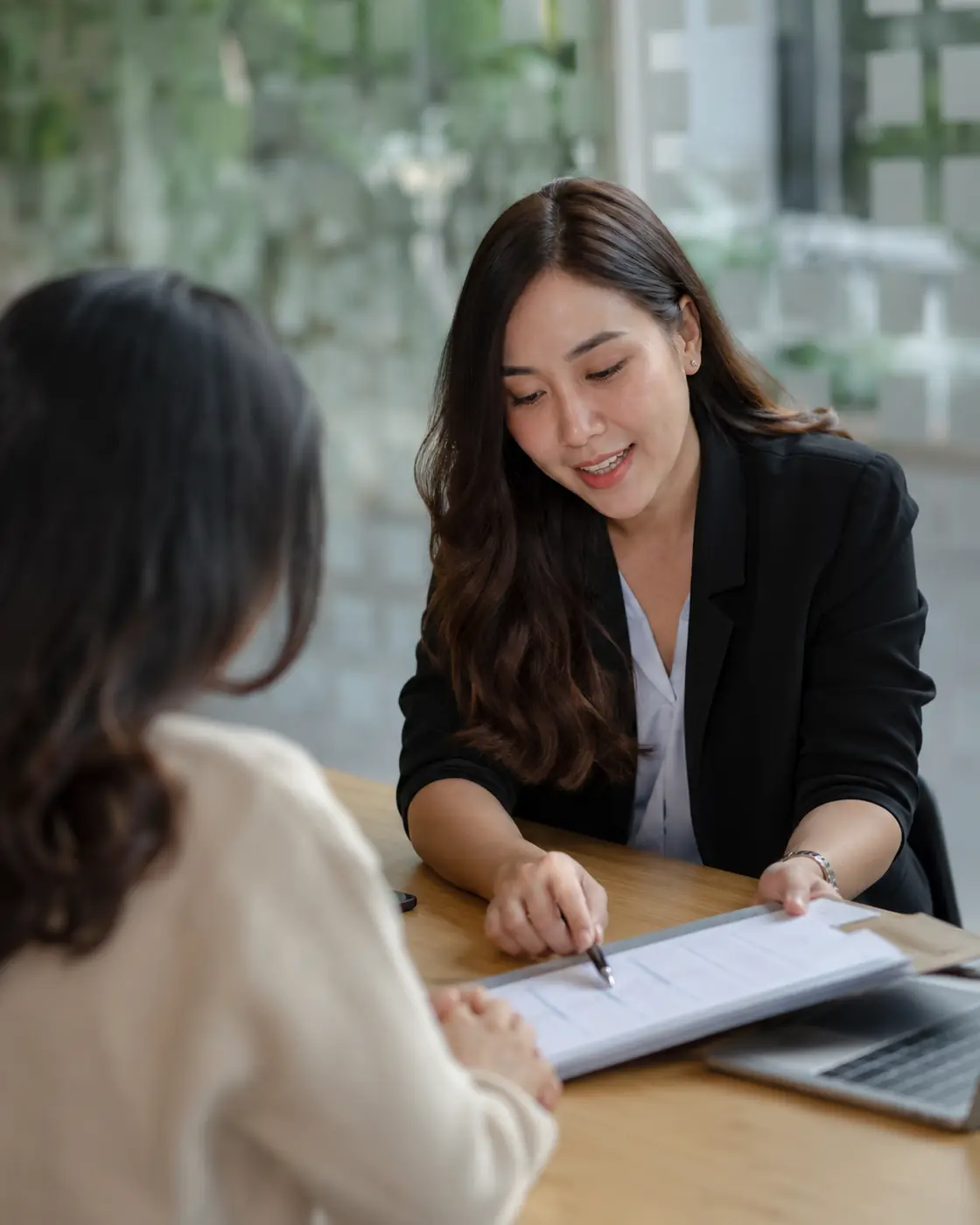 Service adviser reviewing a customer case document.
